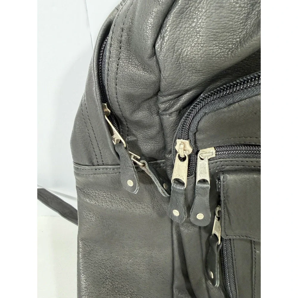 New United Motor Manufacturing Black Leather Backpack Multi Pocket YKK Zipper